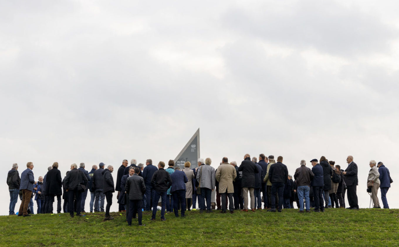 Crowd admiring the Vector of Memory on top of a hill