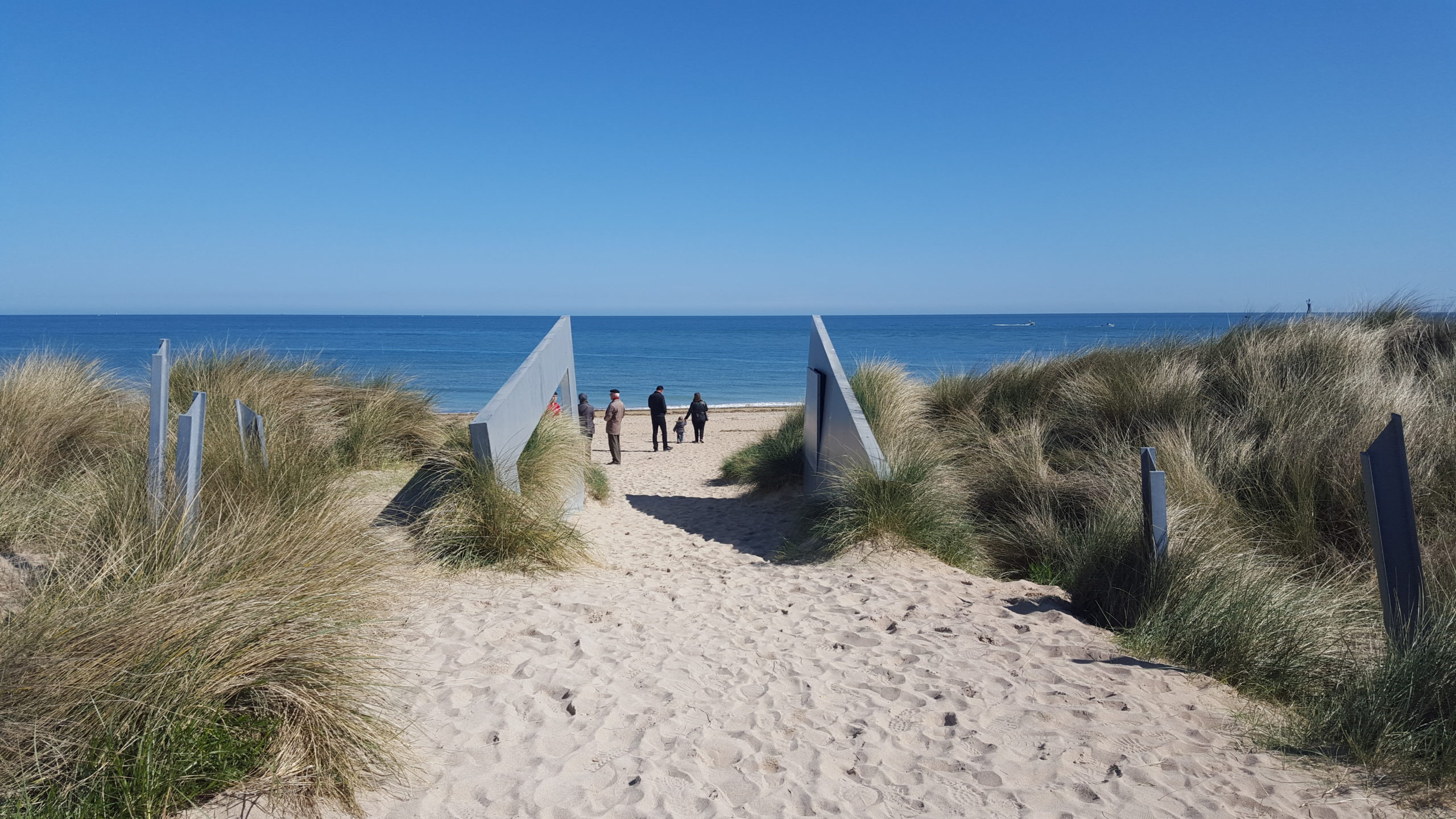 Few people walking on a beach